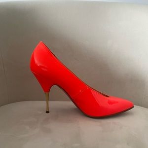 Christian Louboutin neon orange pumps